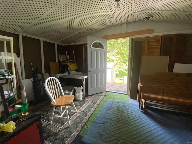 sitting room with lofted ceiling