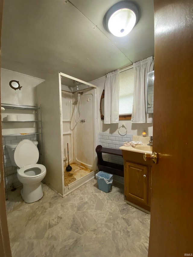 bathroom featuring vanity, tile patterned floors, a shower with shower curtain, tile walls, and toilet