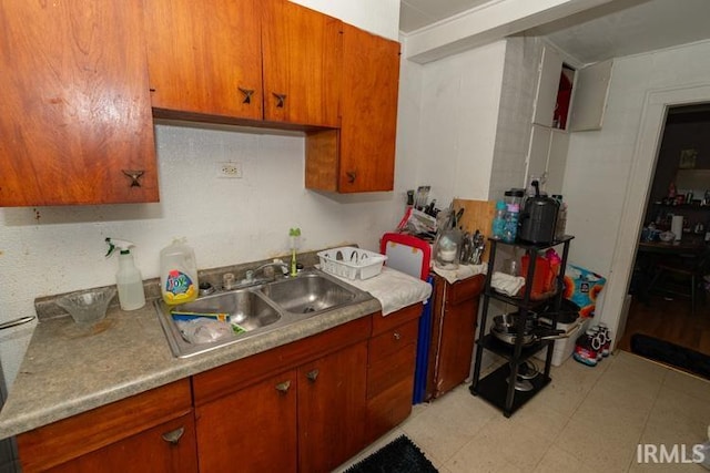 kitchen with sink and light tile patterned floors