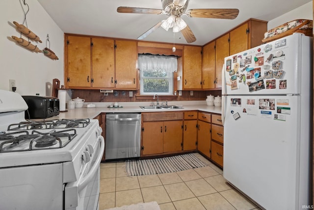 kitchen with light tile patterned flooring, sink, ceiling fan, white appliances, and backsplash