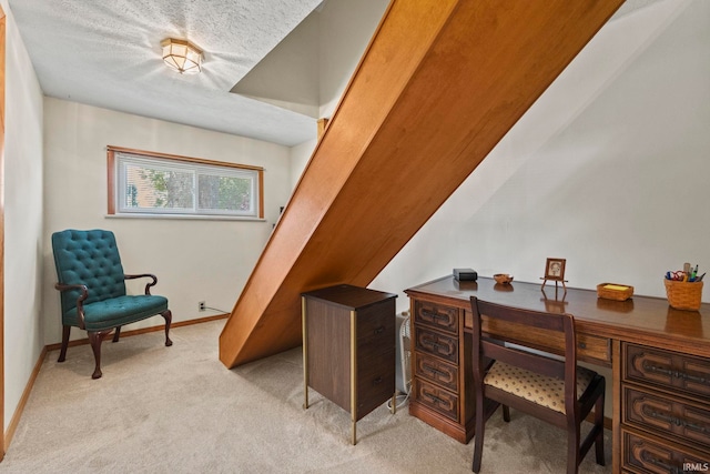 office area with light carpet and a textured ceiling