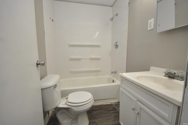 full bathroom with vanity, hardwood / wood-style flooring, bathtub / shower combination, and toilet