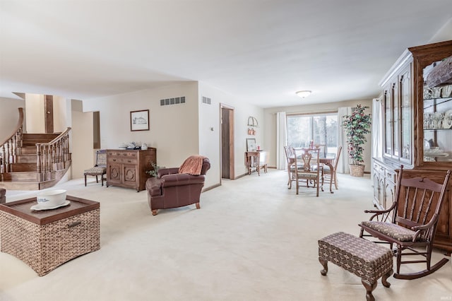 living room with light colored carpet