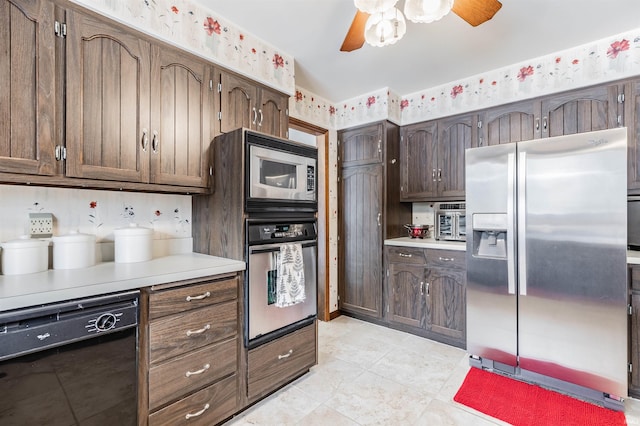 kitchen featuring ceiling fan, appliances with stainless steel finishes, dark brown cabinets, and light tile patterned floors