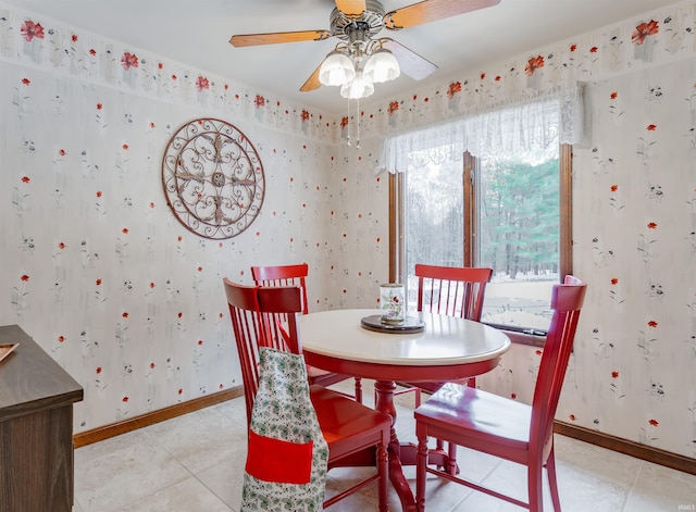 dining space with light tile patterned flooring and ceiling fan