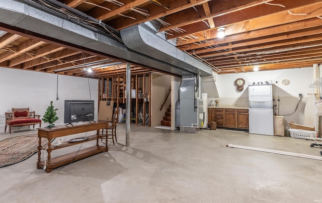 basement featuring washer / dryer and heating unit