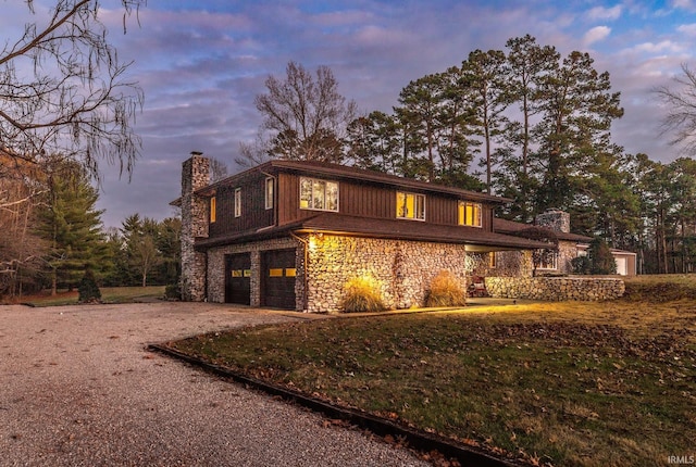 property exterior at dusk featuring a garage