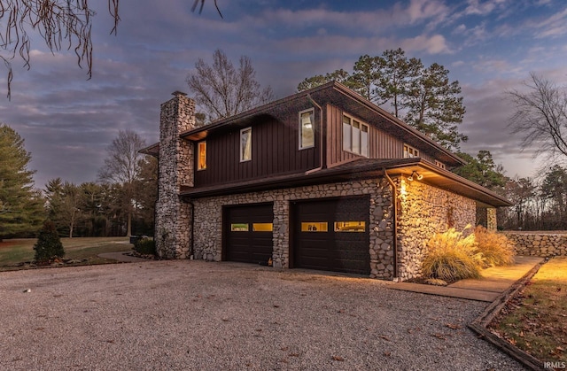 property exterior at dusk with a garage