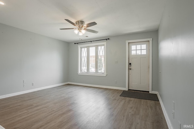 foyer entrance featuring wood-type flooring and ceiling fan