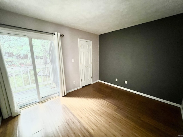 unfurnished living room with ceiling fan and a high ceiling