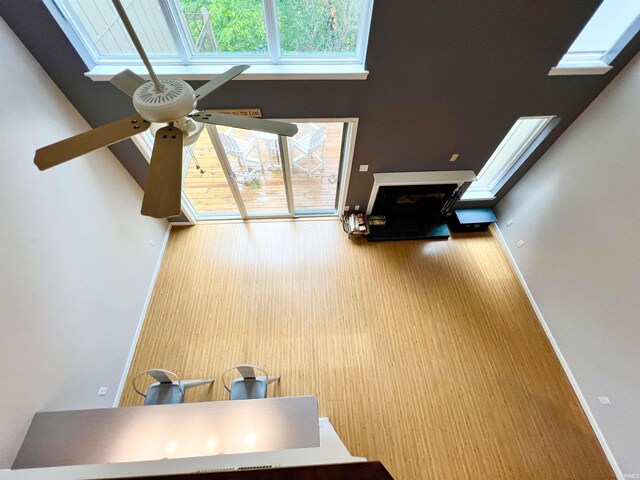 spare room featuring a textured ceiling, dark wood-type flooring, and lofted ceiling