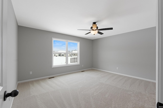 carpeted empty room with ceiling fan