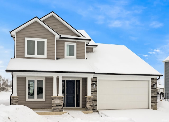 view of front of home with covered porch and a garage