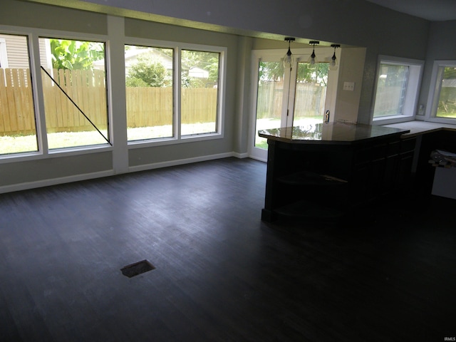 interior space with dark hardwood / wood-style flooring