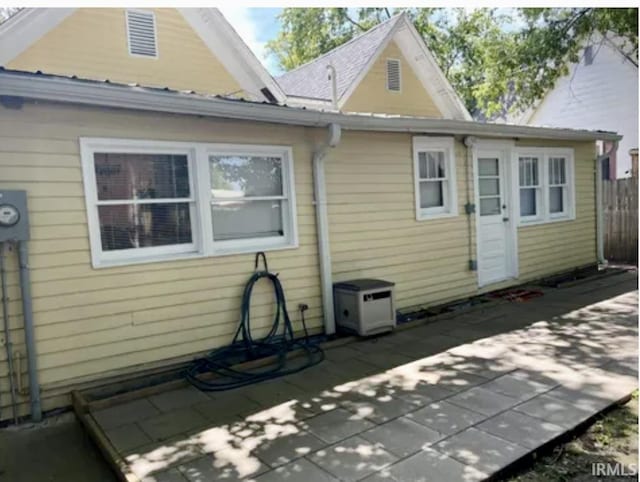 rear view of house featuring a patio