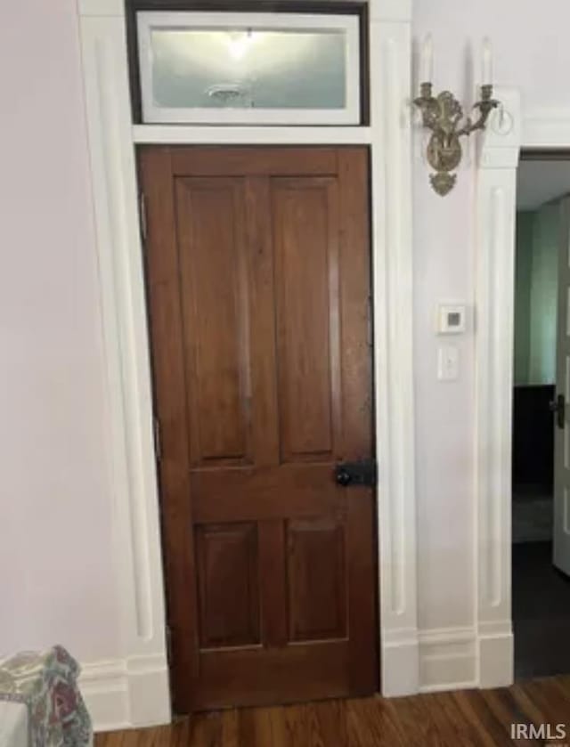 interior space with dark hardwood / wood-style floors