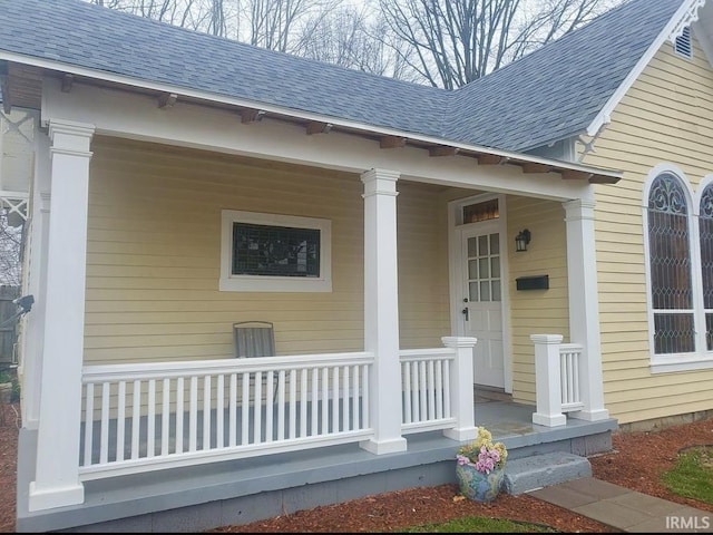 entrance to property featuring covered porch