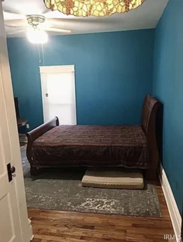 bedroom with hardwood / wood-style floors