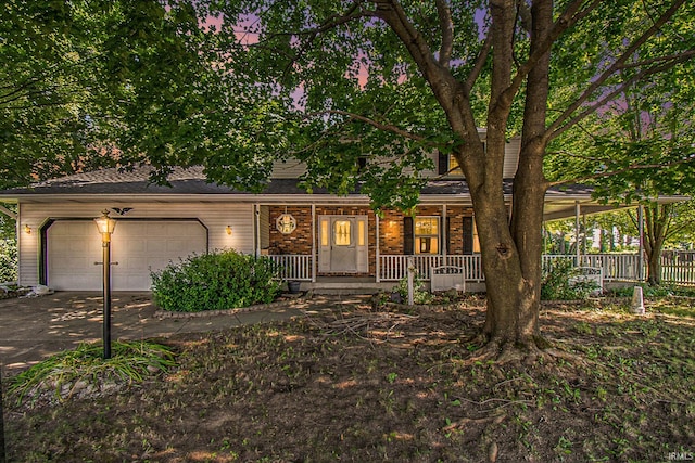 view of front of home featuring a garage and covered porch