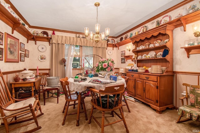 carpeted dining space with an inviting chandelier and crown molding