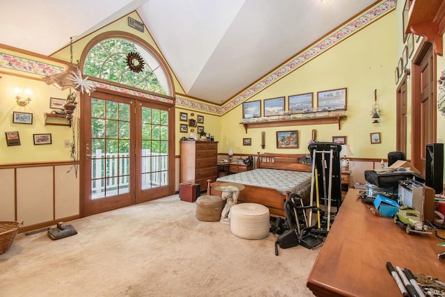 carpeted bedroom featuring access to outside, french doors, and high vaulted ceiling