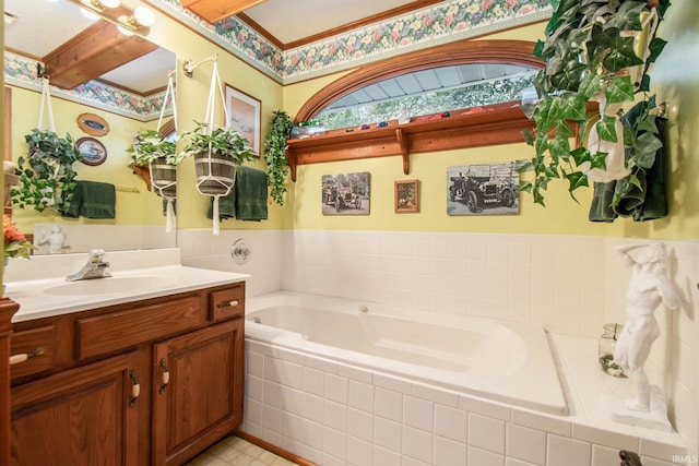 bathroom with vanity and tiled tub