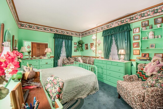 bedroom featuring dark carpet and ornamental molding