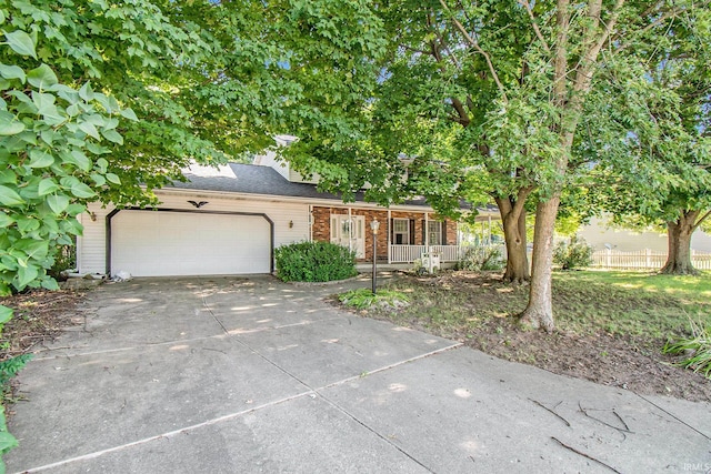 view of front of home featuring a garage and covered porch