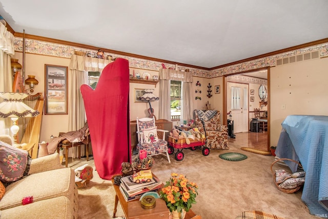 rec room with crown molding and carpet floors