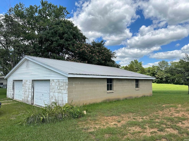 garage with a lawn