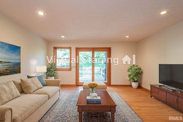 living room with light hardwood / wood-style floors