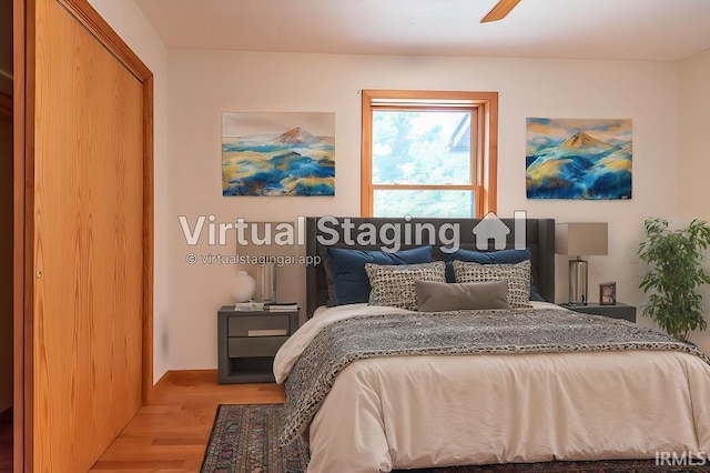 bedroom featuring light hardwood / wood-style flooring and ceiling fan