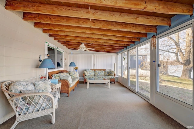 sunroom featuring beam ceiling