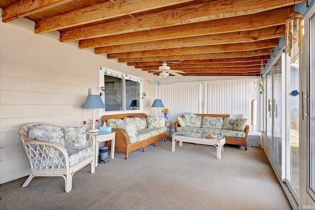 sunroom / solarium with ceiling fan and beam ceiling