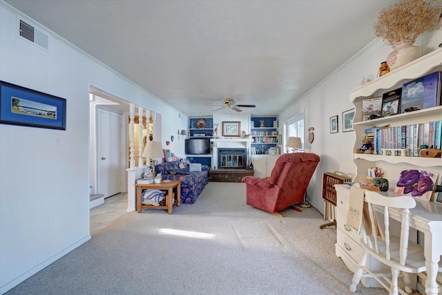 living room featuring light carpet, crown molding, and ceiling fan