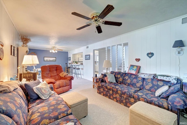 living room featuring carpet floors and ceiling fan