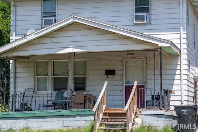 doorway to property featuring covered porch