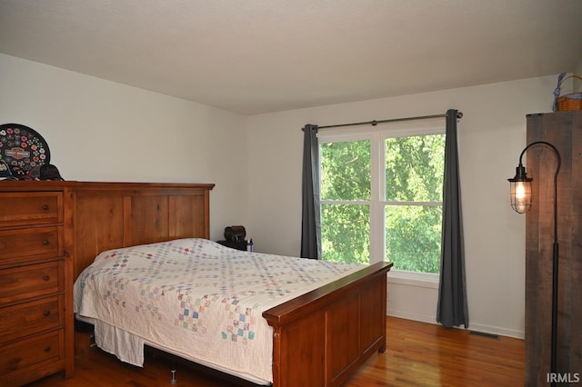 bedroom featuring wood-type flooring