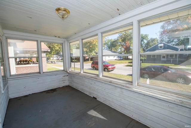 unfurnished sunroom featuring a wealth of natural light