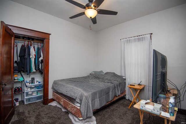 carpeted bedroom featuring a closet and ceiling fan