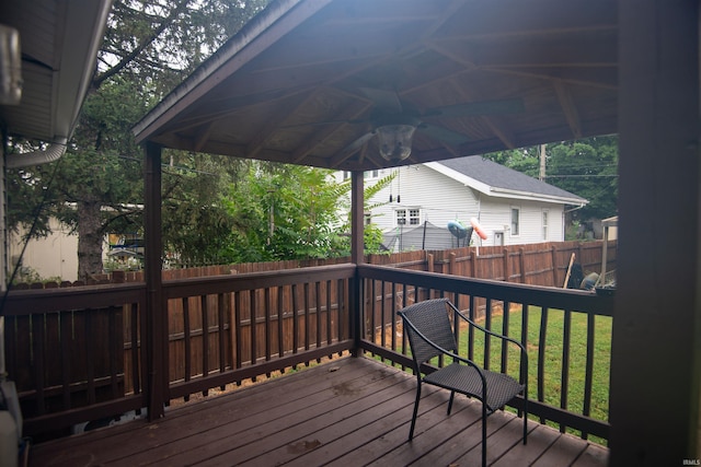 deck featuring a gazebo and a yard