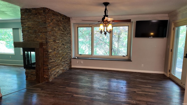 unfurnished living room with ceiling fan, dark hardwood / wood-style floors, and plenty of natural light