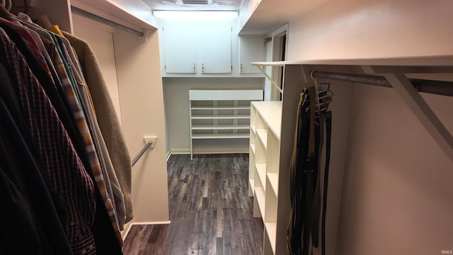 walk in closet featuring dark wood-type flooring