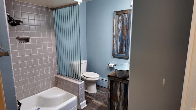 bathroom with a baseboard heating unit, wood-type flooring, and toilet