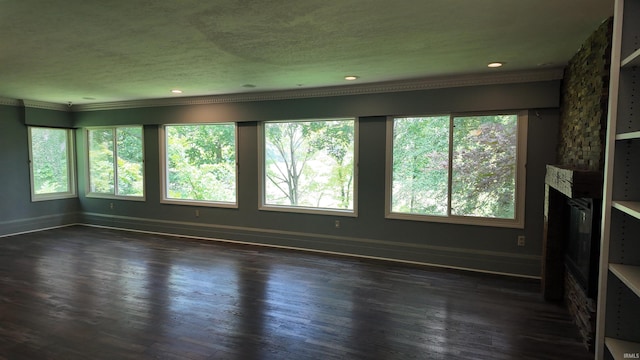 unfurnished living room with a stone fireplace and dark wood-type flooring