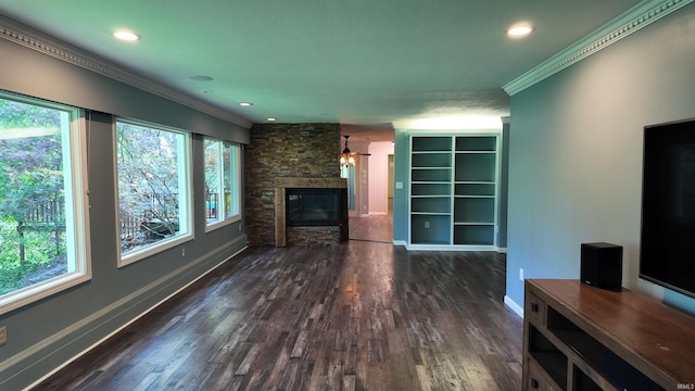 unfurnished living room with dark hardwood / wood-style flooring, a fireplace, and crown molding