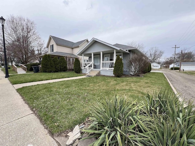 view of front of home featuring a front yard and a porch