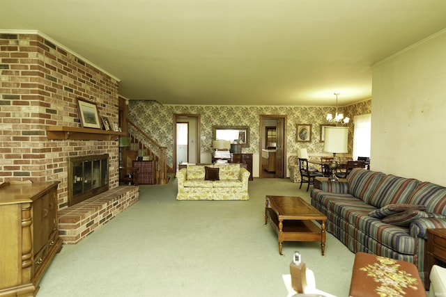 carpeted living area with a chandelier, ornamental molding, a fireplace, and wallpapered walls