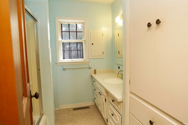 bathroom with vanity and tile patterned flooring