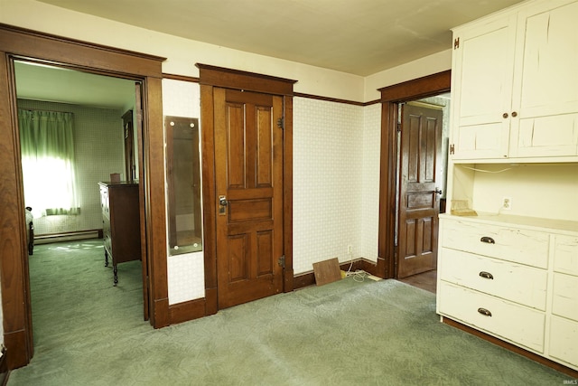 interior space with baseboards, carpet flooring, and wallpapered walls